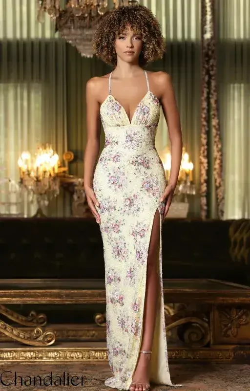 model is wearing a spaghetti strap open back floral yellow dress