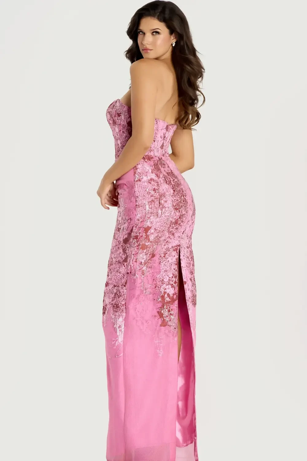 model is wearing a sparkly pink evening dress